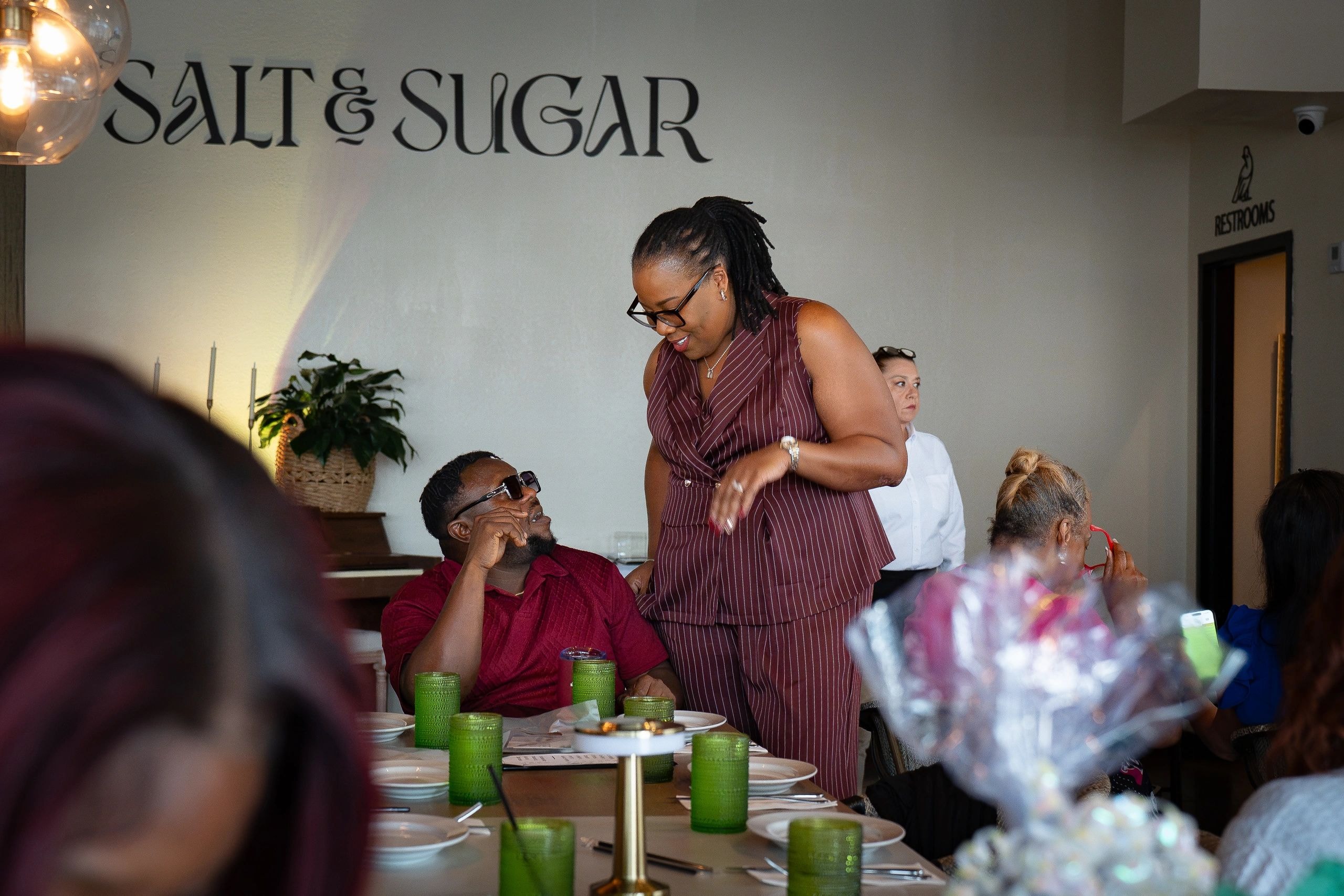 Salt & Sugar sign with attendees engaging