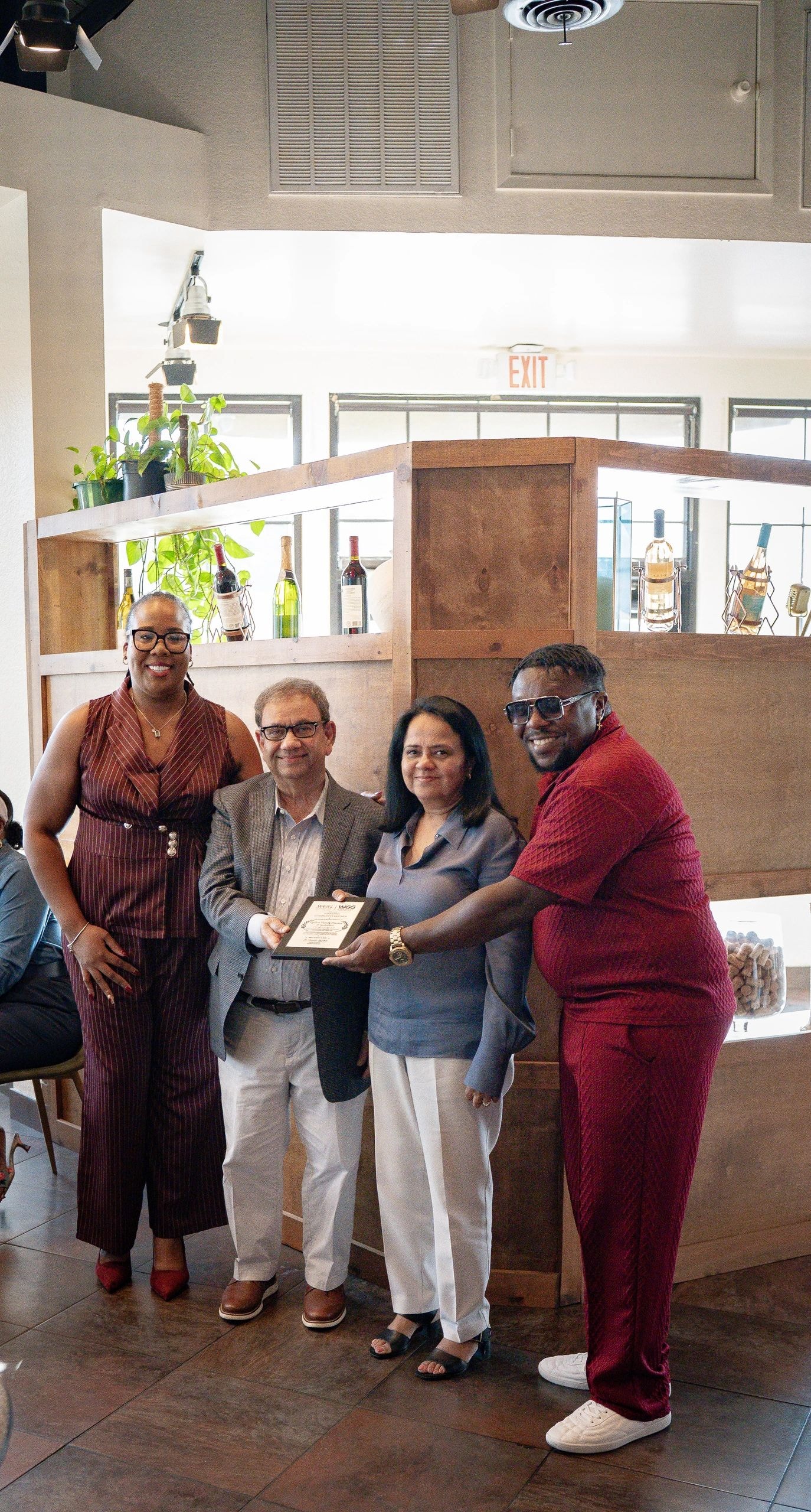 Four Founding Partners holding awards at WGG Connect